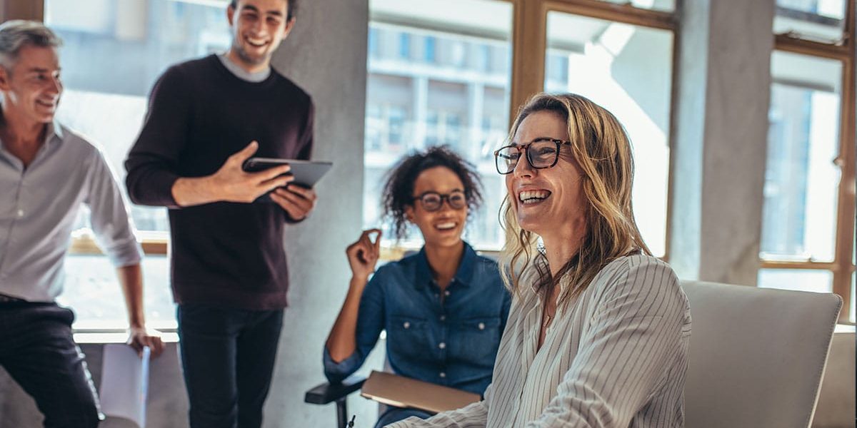 A Group Of People Standing In Front Of A Window